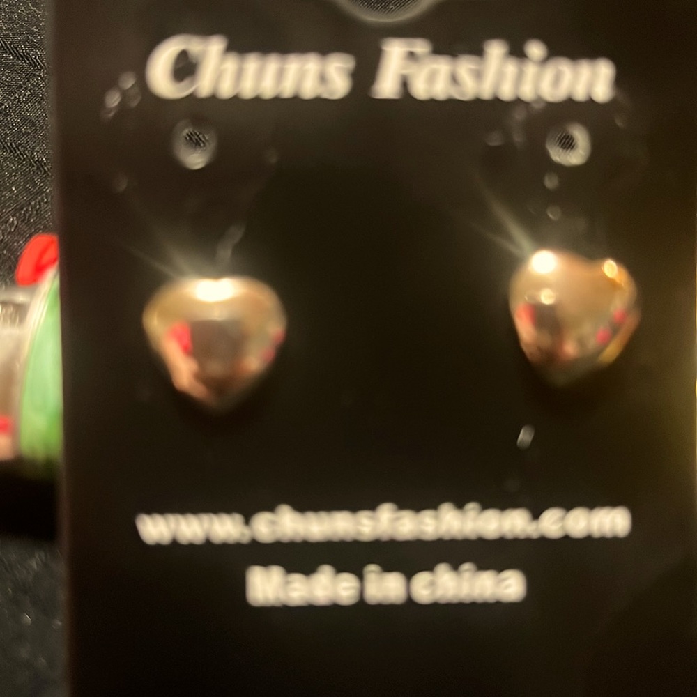 Silver toned heart-shaped stud earrings